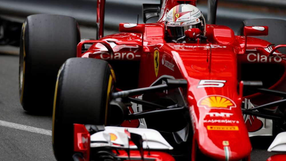 Speeding Red Fury on the F1 Track wallpaper