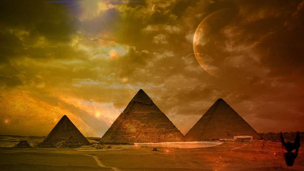 Mystical Sunset Over Ancient Pyramids wallpaper