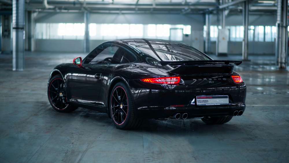 Sleek Black Porsche 911 Exuding Elegance wallpaper