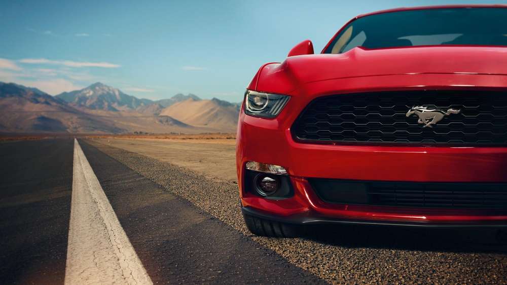 Red Ford Mustang Dominating the Open Road wallpaper