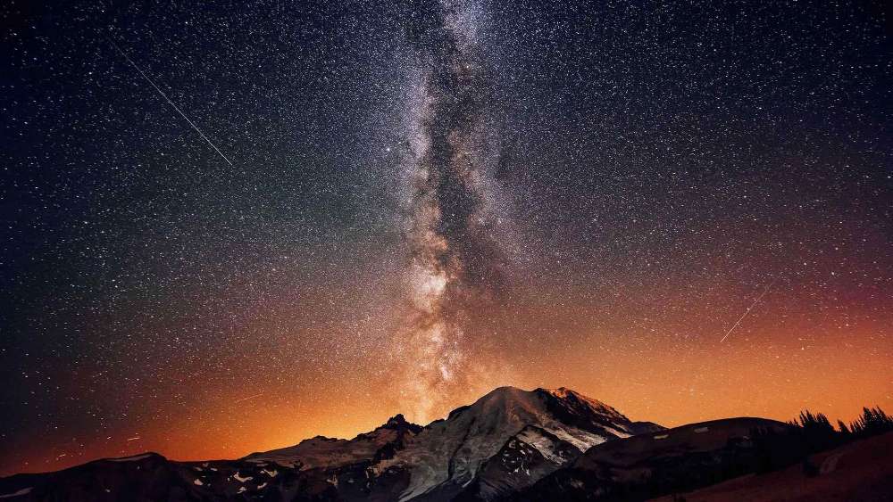 Starry Skies Above a Majestic Mountain wallpaper