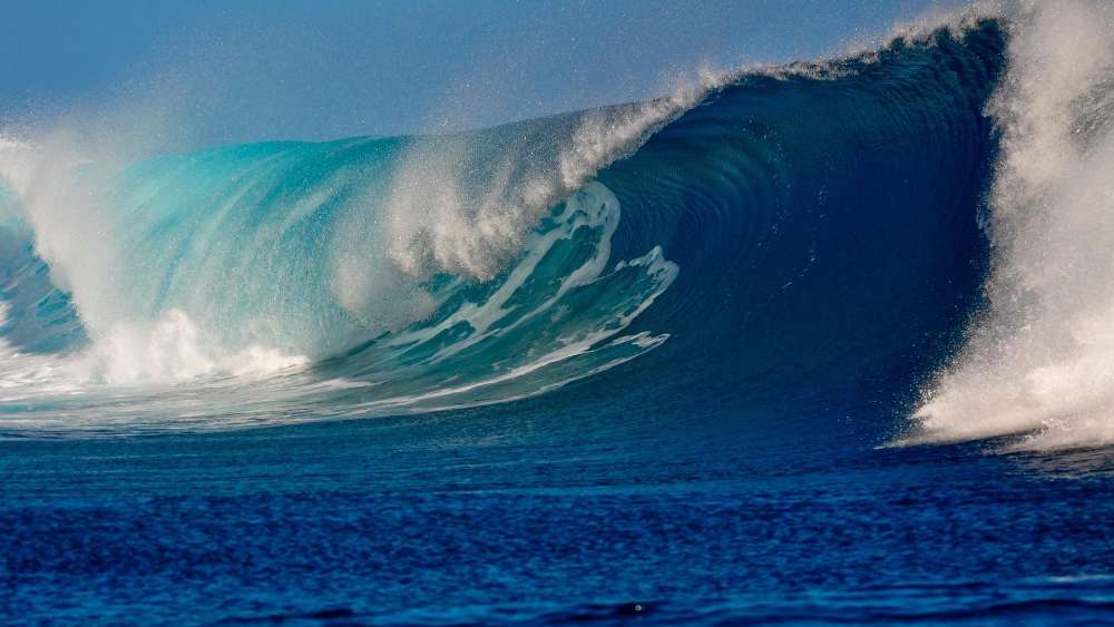 Majestic Ocean Wave Riding the Horizon wallpaper