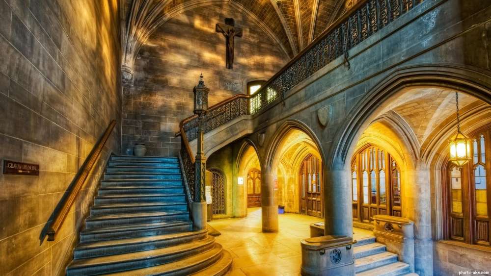 Majestic Temple Interior with Grand Staircase wallpaper