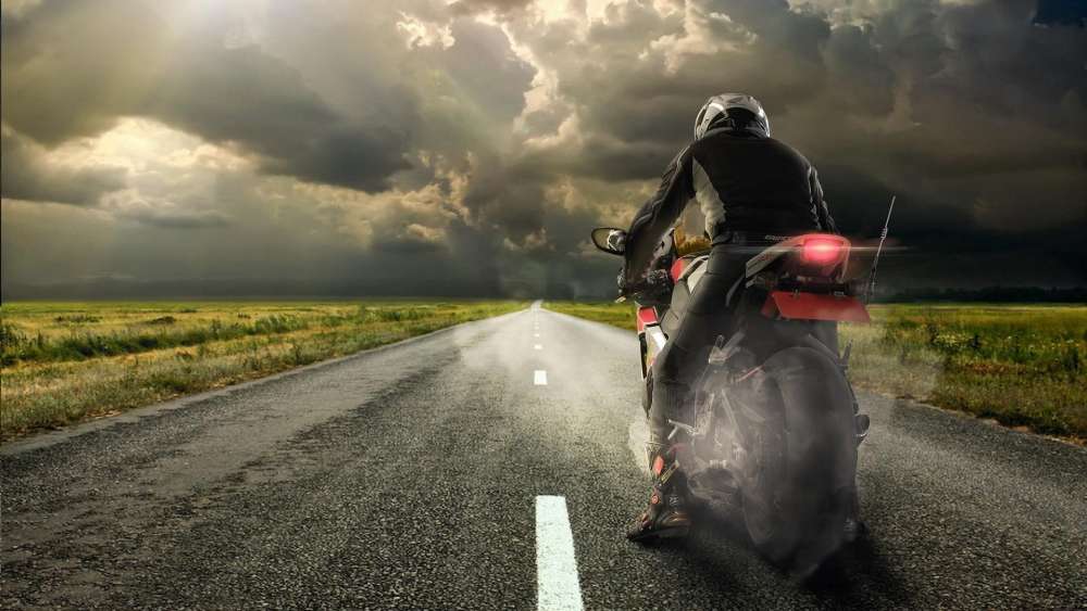 Motorbike Journey on a Stormy Road wallpaper
