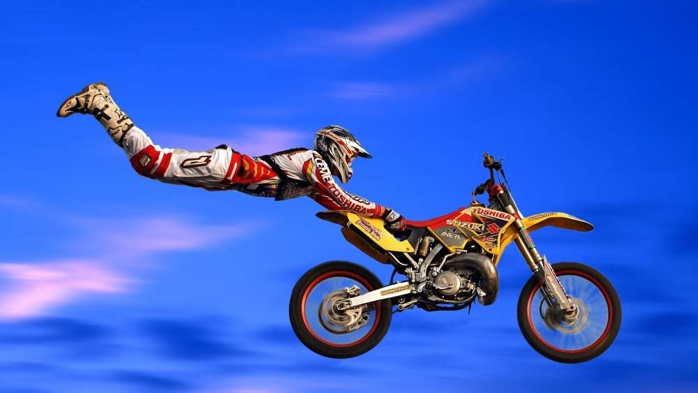 Exciting Motocross Mid-Air Stunt wallpaper