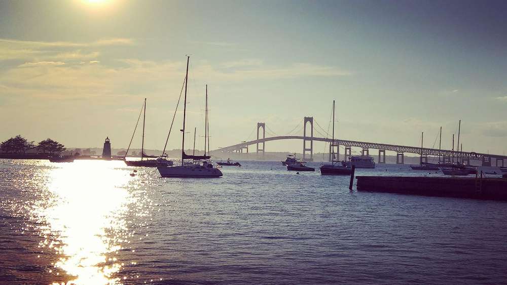 Serene Sunrise Over the Bay with Boats Morning Calmness Awaits wallpaper