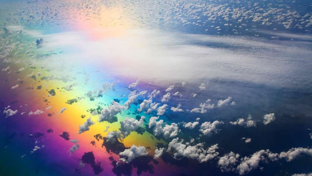 Aerial Rainbow Mirage Over Fluffy Clouds wallpaper