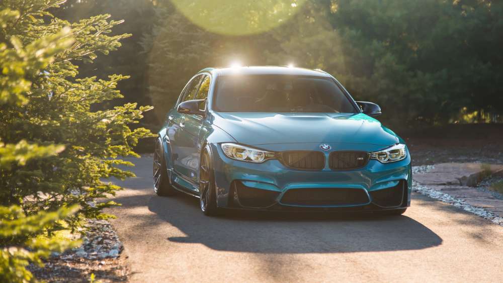 Title: Sleek Blue Dream Car in Sunlit Driveway wallpaper