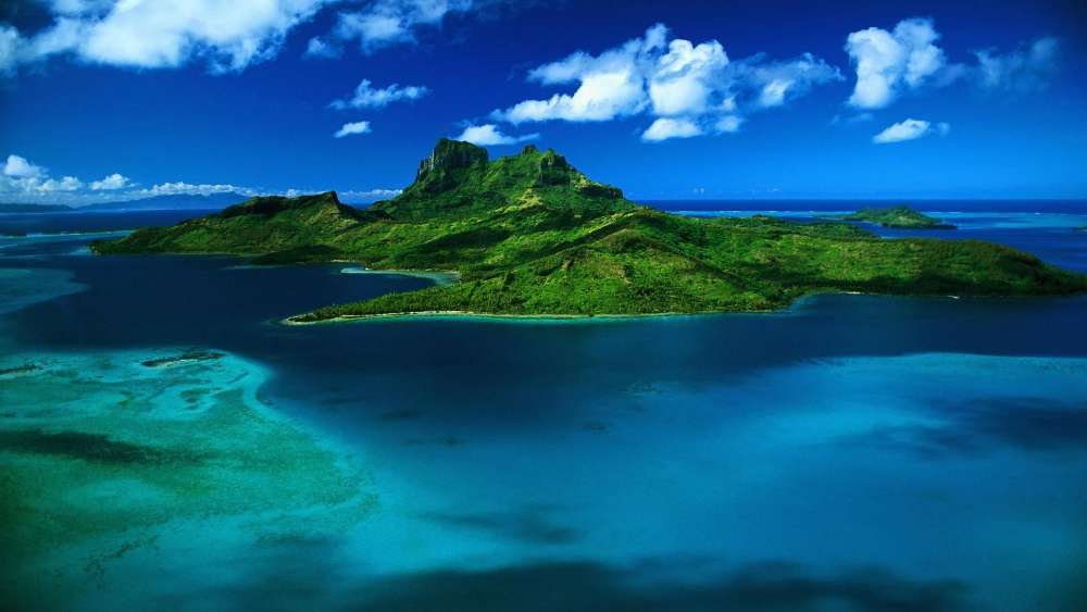 Blue Tranquility Over Lush Island Vista wallpaper