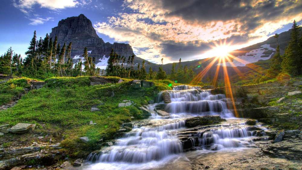 Serene Waterfall Under Radiant Sunlight wallpaper