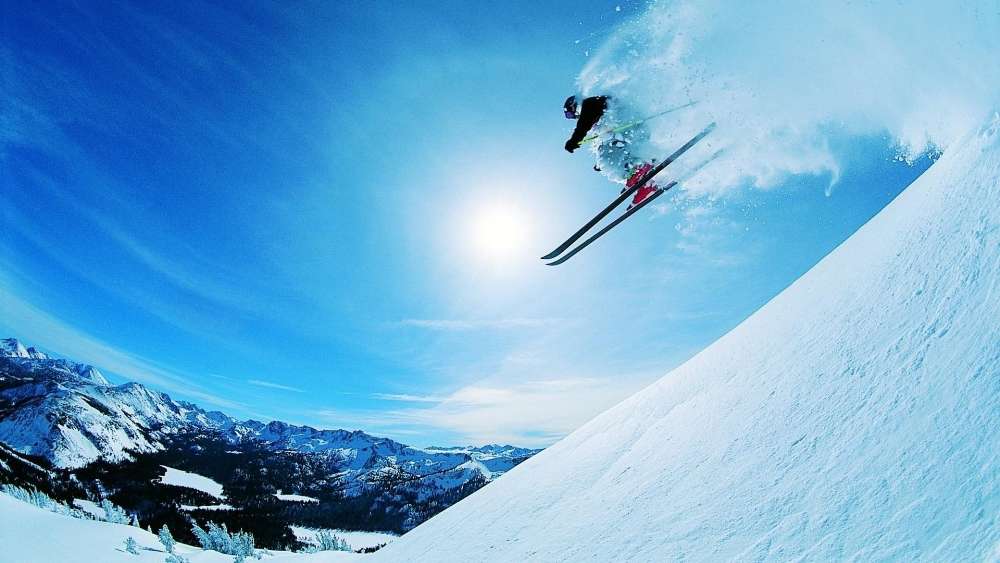 Skiing High in the Snowy Mountains wallpaper