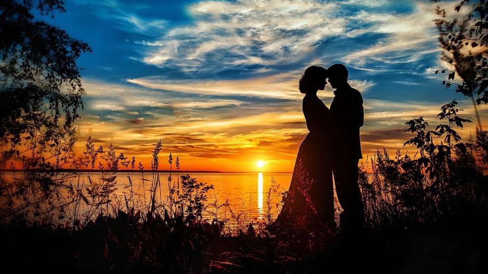 Sunset Embrace by the Lake wallpaper