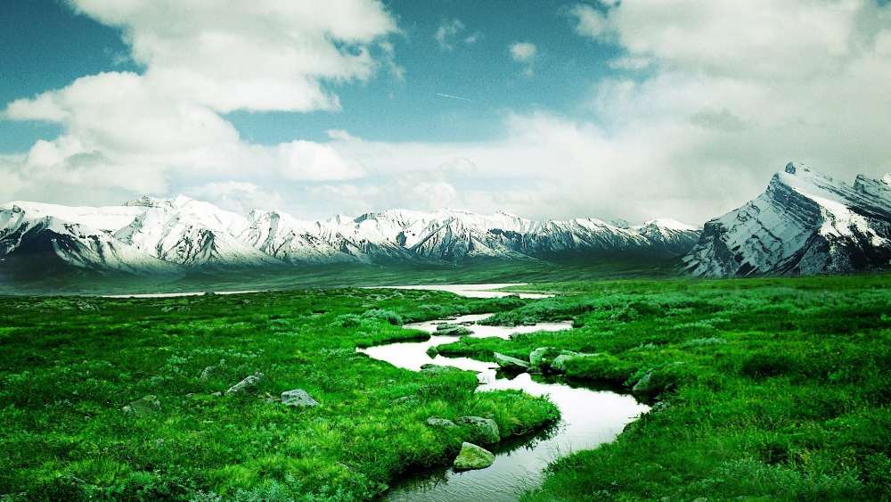 Mountain Range and Serene Green Field wallpaper