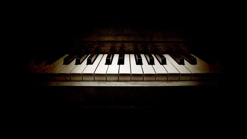 Mysterious Piano Keys in Shadows wallpaper