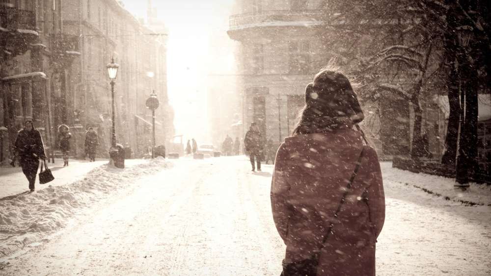 Winter Serenade on a Snowy City Street wallpaper