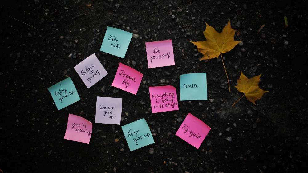 Motivational Messages Amidst Autumn Leaves wallpaper