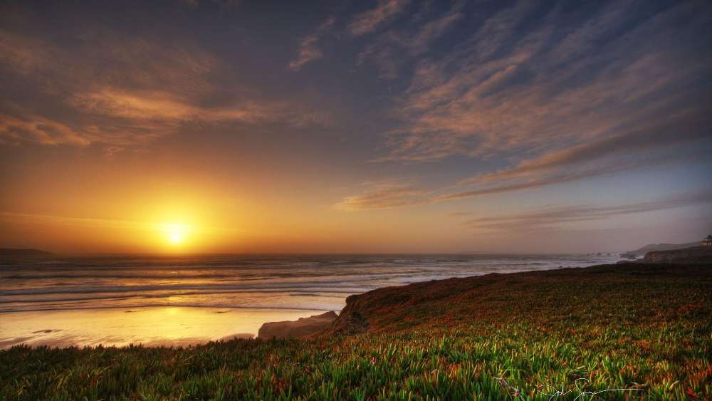 Serene Sunset by the Ocean Shore wallpaper