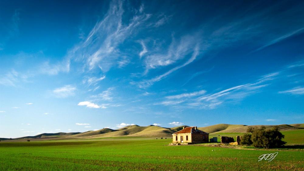 Serene Homestead in Lush Green Landscape wallpaper
