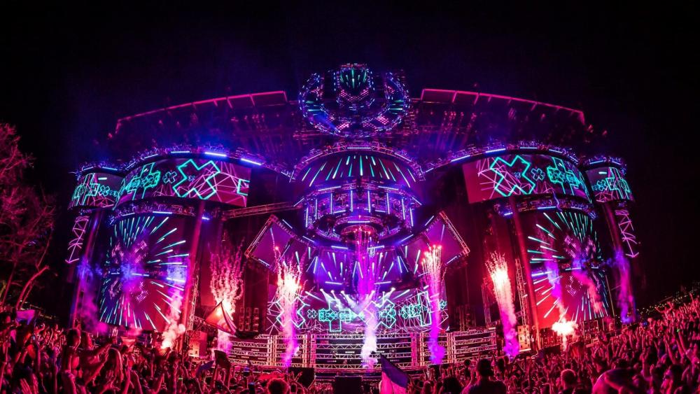 Electrifying Festival Stage Lit Up at Night wallpaper