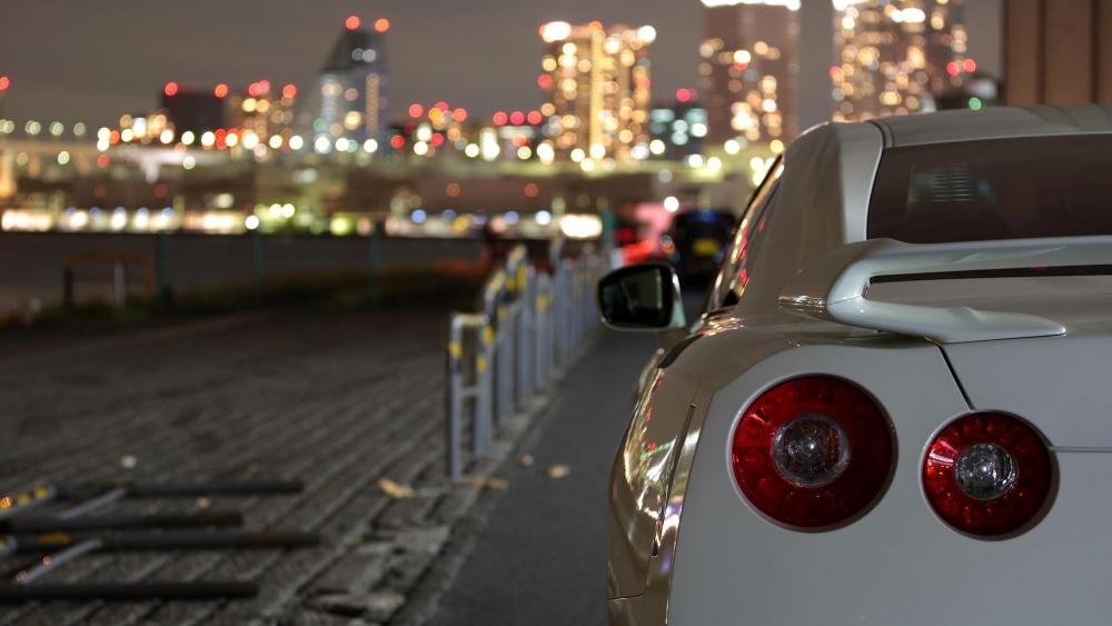 Nissan GTR R35 Against City Lights wallpaper