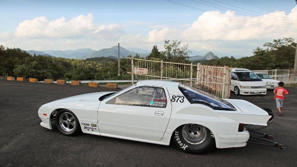 Sleek Racer on the Open Road wallpaper