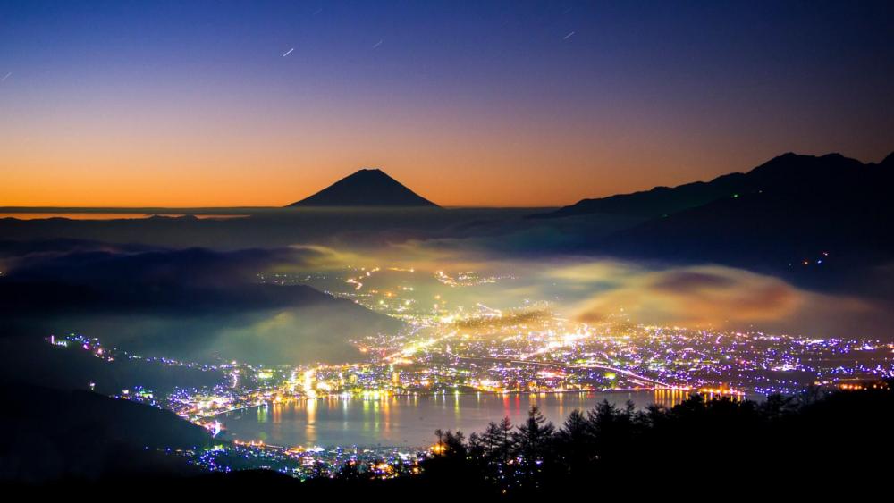 City lights at the foot of the Mount Fuji wallpaper