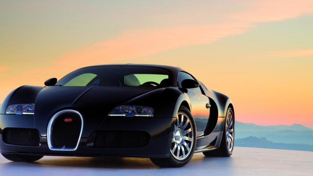 Sleek Black Beauty Against a Sunset Horizon wallpaper