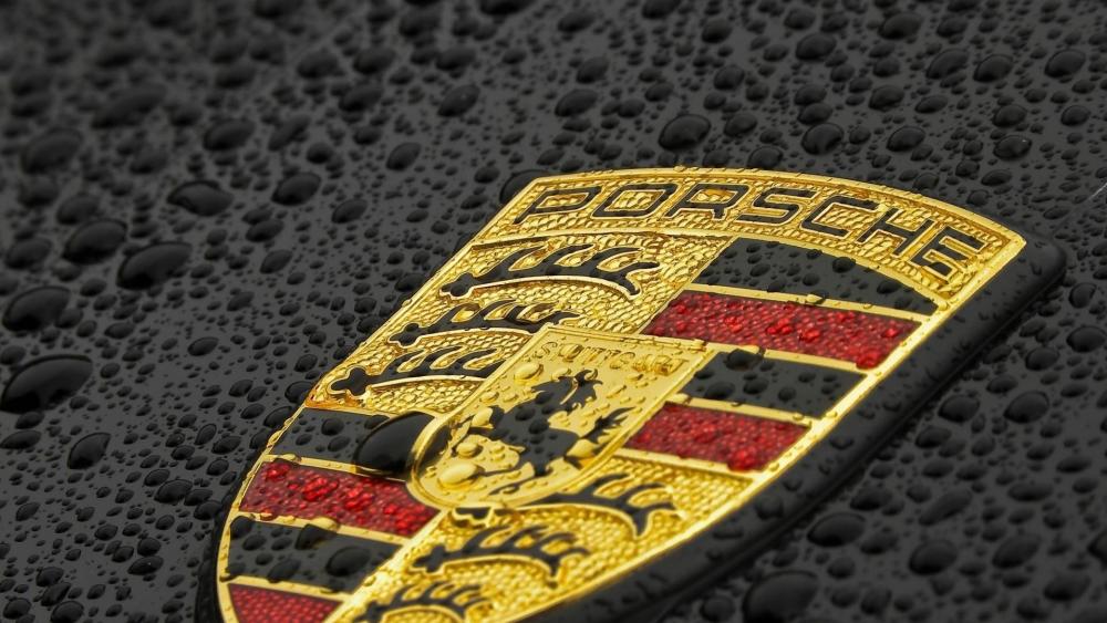 Gleaming Porsche Emblem in Raindrops wallpaper