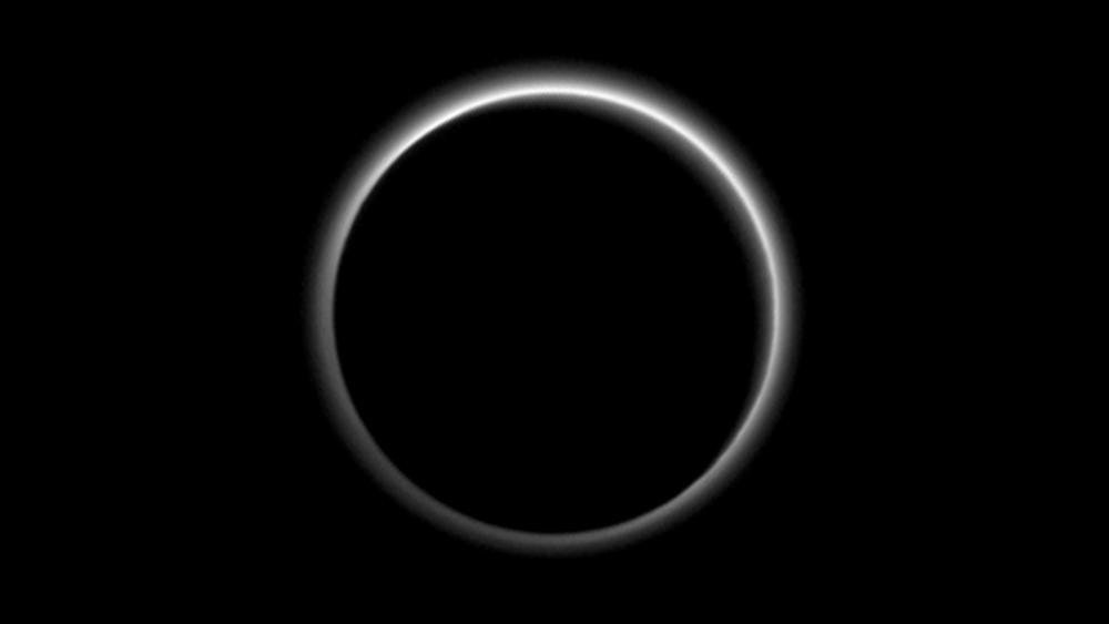 Pluto's Silhouette Against the Sun's Corona wallpaper
