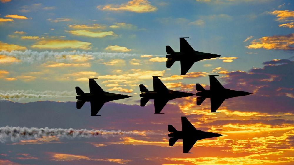 Jets in Formation Against a Stunning Sunset wallpaper