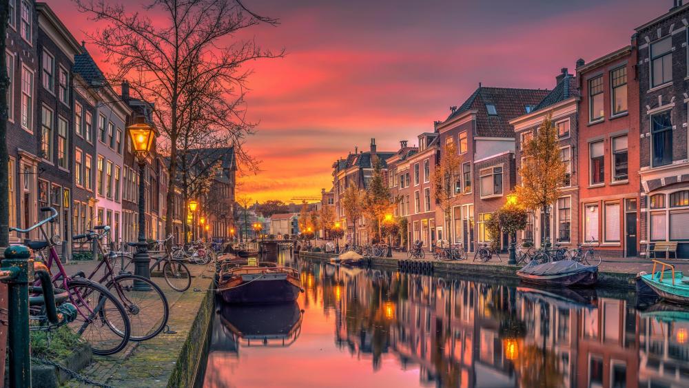 Twilight Glow on a Serene Canal in Amsterdam wallpaper