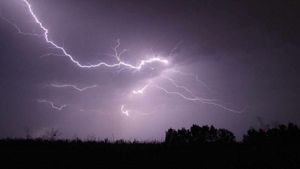 Ethereal Dance of Lightning in the Night Sky wallpaper