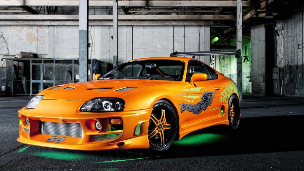 Orange Toyota Supra Basking in Garage Glow wallpaper
