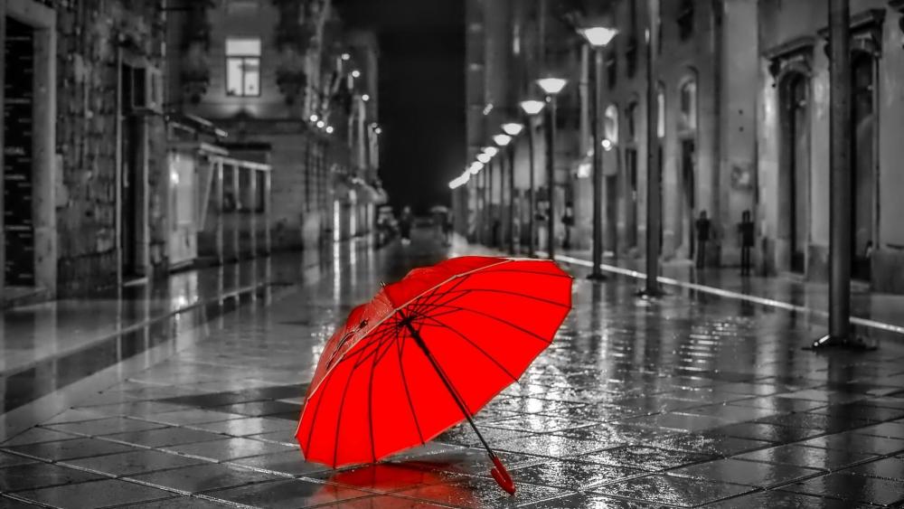 Red umbrella on the rainy street wallpaper