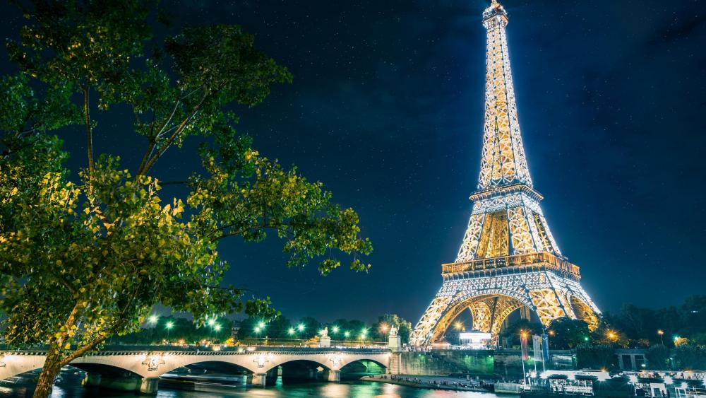 Paris at night - Starry night sky above the Eiffel Tower wallpaper
