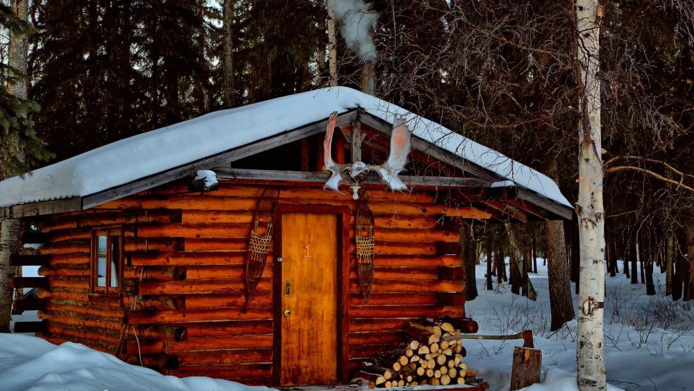 Winter log cabin in Alaska wallpaper