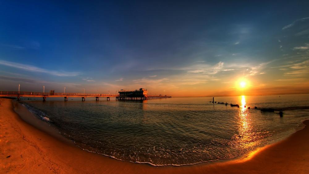 Sunset panorama over the beach in Maldives wallpaper