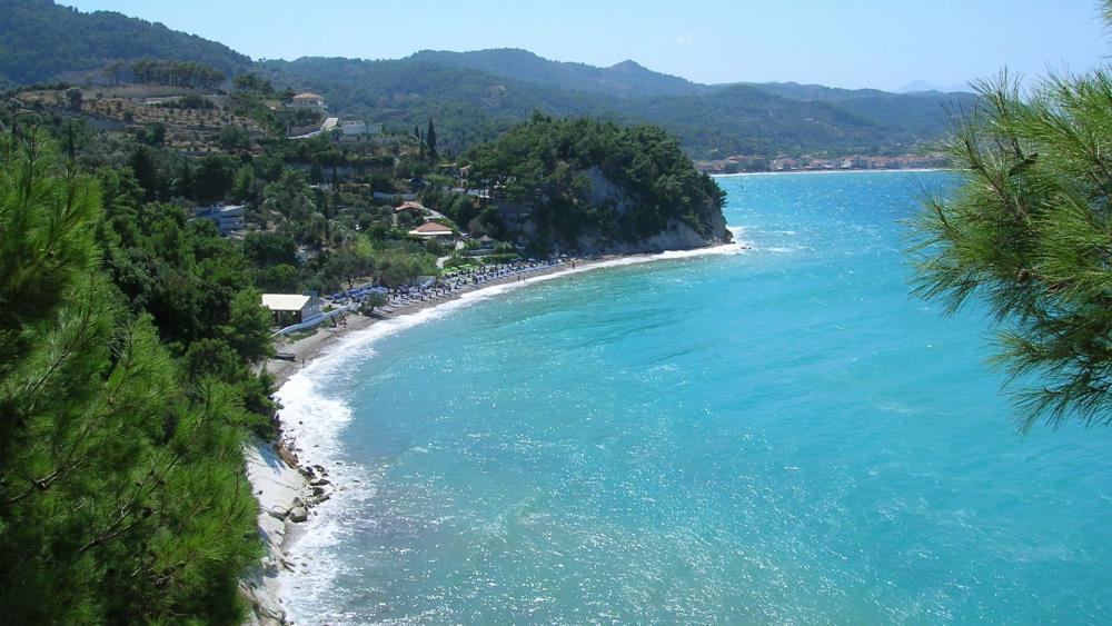 Greek beach with azure blue sea wallpaper