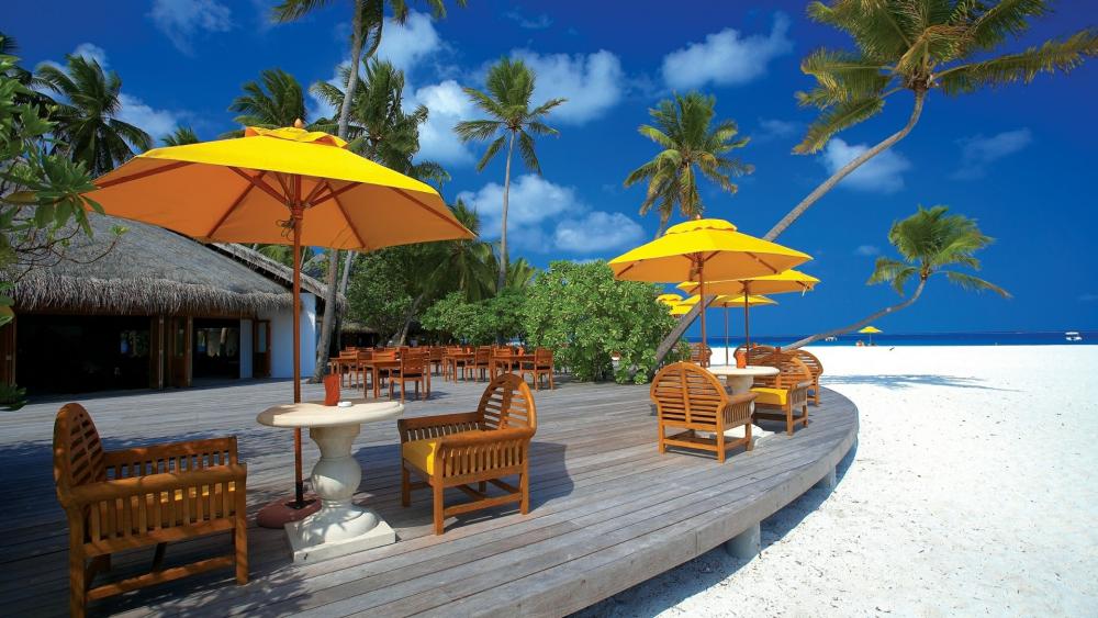 Yellow parasols in the beach - Maldives wallpaper