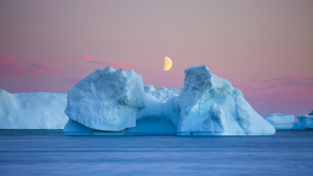 Half moon over the iceberg wallpaper