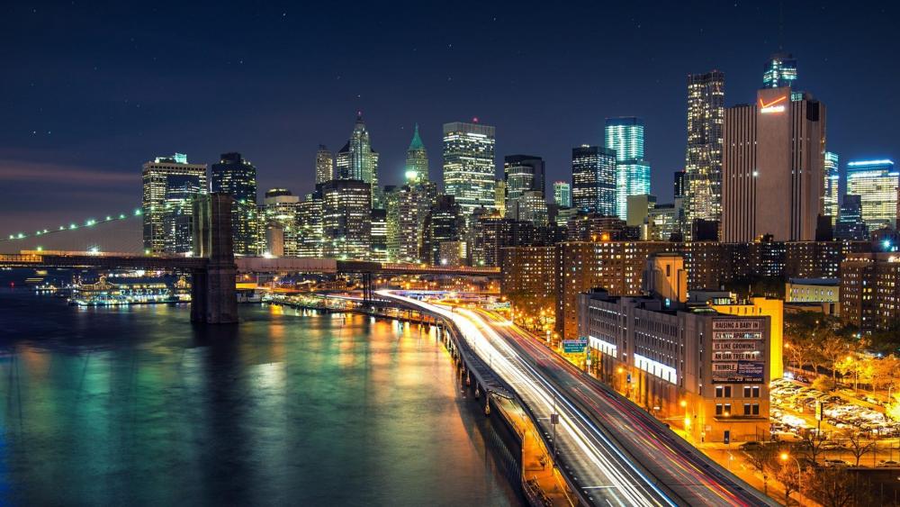 New York city lights at night from the East River wallpaper