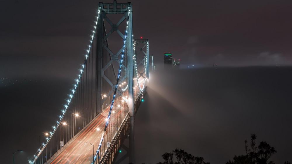 The misty San Francisco–Oakland Bay Bridge at night wallpaper