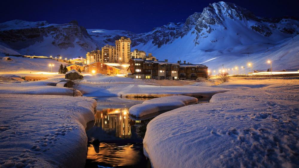 Luxury ski resort at night in Tignes, France wallpaper