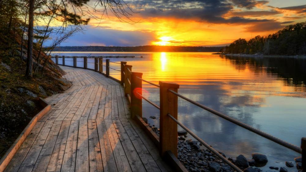 Boardwalk along the lake at sunset wallpaper
