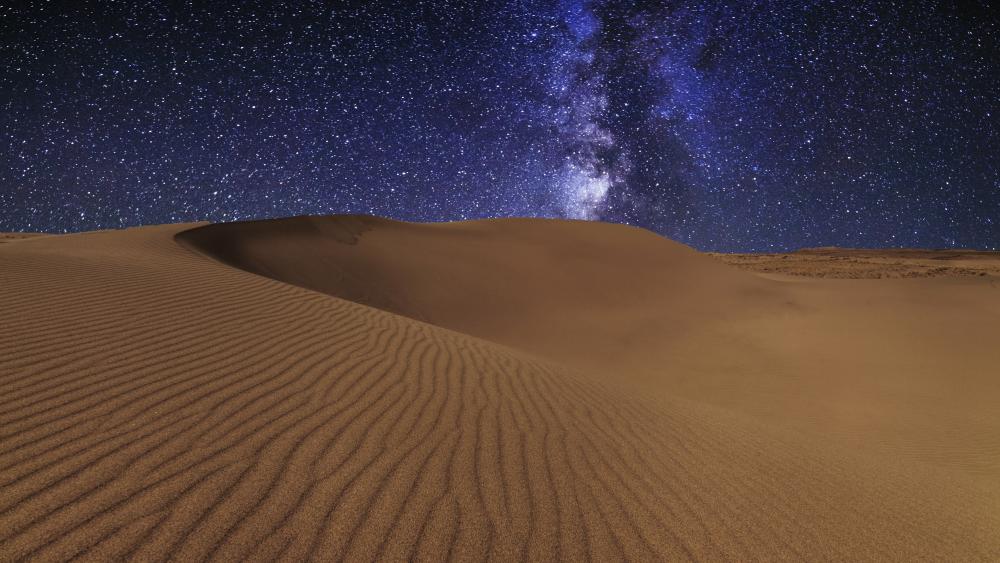 Milky way above the desert dunes wallpaper