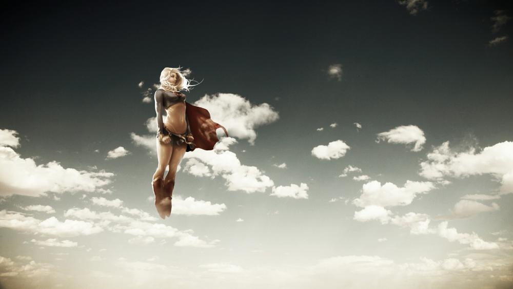 Supergirl flying on the sky wallpaper