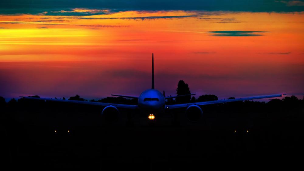 Airplane in the sunset wallpaper