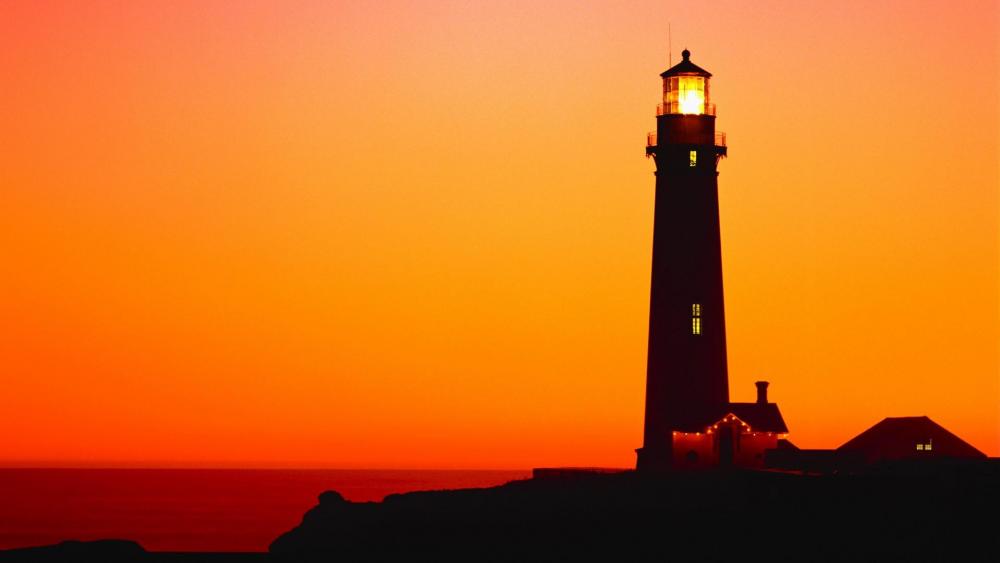 Lighthouse silhouette in the sunset wallpaper