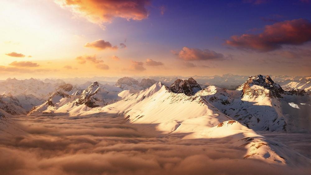 Mountain peaks above the clouds wallpaper
