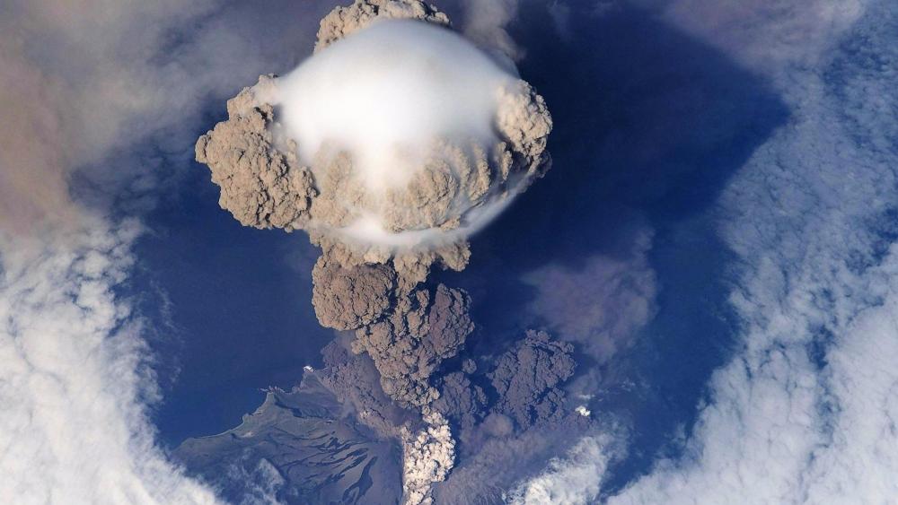 Aerial view volcano eruption steam wallpaper